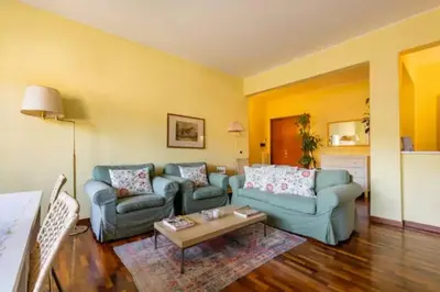 a living room with two couches and a coffee table at Notte al Vaticano in Rome