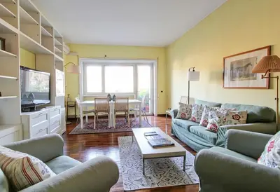a living room with two couches and a table at Notte al Vaticano in Rome