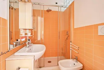 a bathroom with a sink and a shower and a toilet at Notte al Vaticano in Rome