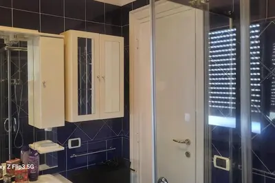 a bathroom with a shower and a sink and a mirror at Notte al Vaticano in Rome