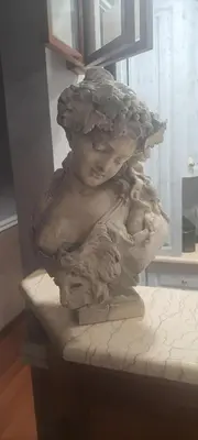 a statue of a bust of a woman holding a mushroom at Sandel Giubileo Hotel in Rome