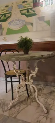 a table with a potted plant on top of it at Sandel Giubileo Hotel in Rome