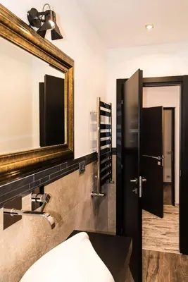 a bathroom with a mirror and a sink at Trevi & Pantheon Luxury Rooms in Rome