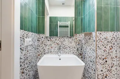 a bathroom with a white sink and a mirror at BDC - Termini Dreaming 3-BDR in Rome