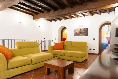 a living room with two couches and a coffee table at Domus LXVII Monti in Rome