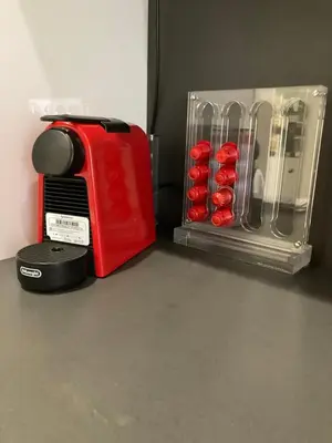 a red toaster sitting on top of a counter at Cami Luxury Flat Rome in Rome