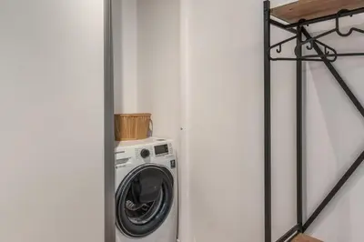 a washer and dryer in a small room at Fresh House Vaticano in Rome