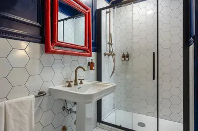a bathroom with a sink and a shower at V Collection Condotti in Rome