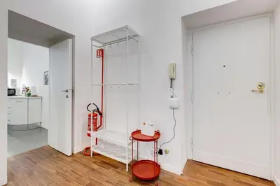 a room with a shower and a red stool at InTheMoodForRome - Musei Vaticani in Rome