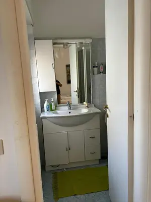 a bathroom with a sink and a mirror at Conca d'Oro 212 in Rome