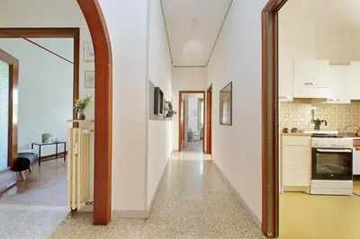 an open hallway with a kitchen and a living room at Micheles Flat by DomusDimore in Rome