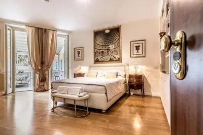 a bedroom with a large bed and a door at The Terrace Luxury in Rome