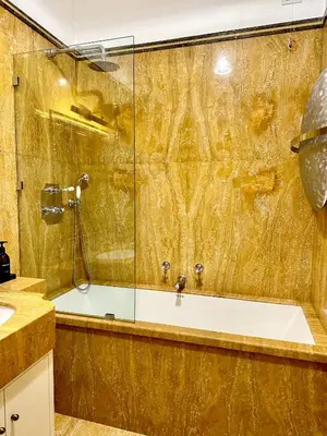 a bathroom with a shower and a bath tub at The Terrace Luxury in Rome