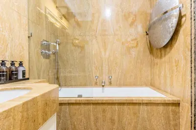 a bathroom with a tub and a sink and a shower at The Terrace Luxury in Rome