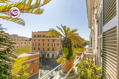 a view of a city from a balcony with plants at C M Civitas Leonina Luxury in Rome