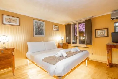 a bedroom with a bed with two towels on it at Easybnb - Bear Home in Rome