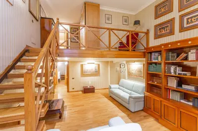 a living room with a staircase and a couch at Easybnb - Bear Home in Rome