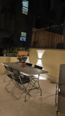 a table and chairs sitting on top of a building at SamDom's Home City Station termini Rome in Rome