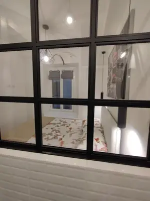 a view of a bedroom through a window at SamDom's Home City Station termini Rome in Rome