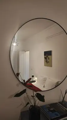 a mirror in a room with a bed and a bedroom at SamDom's Home City Station termini Rome in Rome