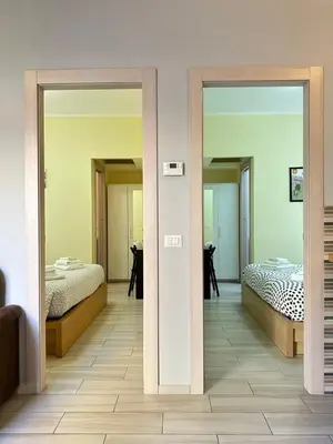 two mirrors in a room with two beds at Casina dei Gemelli in Rome