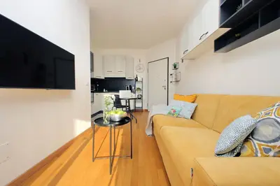 a living room with a couch and a table at Martas flat by DomusDimore in Rome