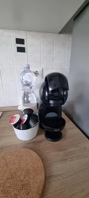 a coffee maker sitting on top of a table at Attico a Gianicolense in Rome