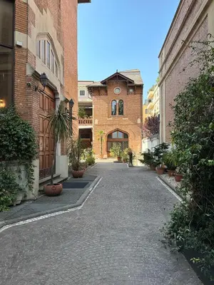 an empty alley in a building with a brick building at Femi apartments in Rome