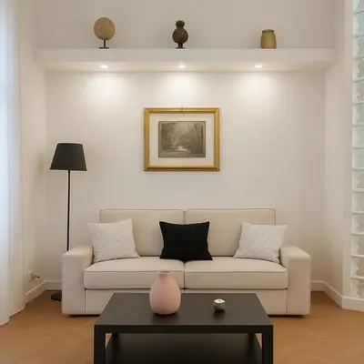 a living room with a couch and a table at Femi apartments in Rome