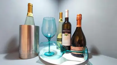 a group of bottles of wine and a glass at La Dolce Vita in Rome