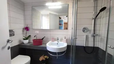 a bathroom with a sink and a shower at La Dolce Vita in Rome