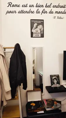a room with a mirror and a desk with at La Dolce Vita in Rome