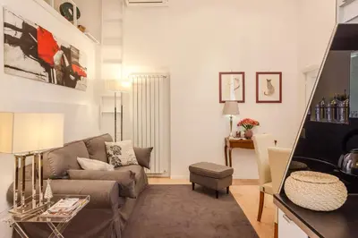 a living room with a couch and a table at La Casa Di Teo in Rome