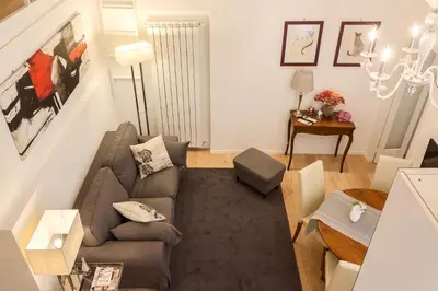 a living room with a couch and a table at La Casa Di Teo in Rome