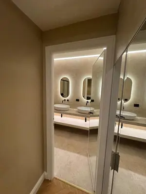a bathroom with sinks and mirrors in a room at Vatican Loft - Liberty Collection in Rome