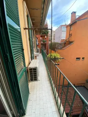 a balcony of a building with a bench on it at Domus Alexandra in Rome