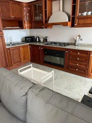 a living room with a couch in a kitchen at Domus Alexandra in Rome