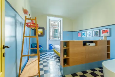 a childs room with a ladder and a bunk bed at iFlat Colorful New Apartment in Esquilino in Rome