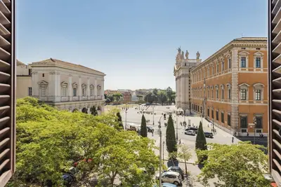 a view of a street in a city with buildings at Appartamento panoramico vicino al Colosseo in Rome