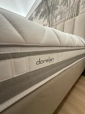 a mattress with the word doridian on it at Lumi Hotel in Rome