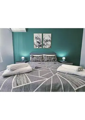 a large bed with two pillows on top of it at Erika's Apartment in Rome