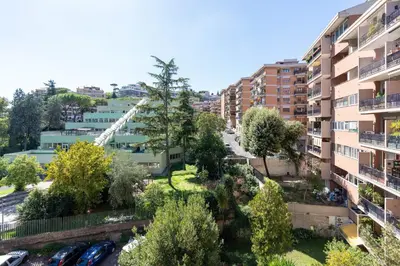 an apartment building with a fire truck at Apartment Valle Aurelia Metro in Rome