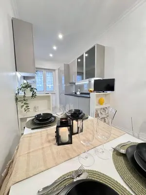 a kitchen with a table with wine glasses on it at Casa Giulia in Rome