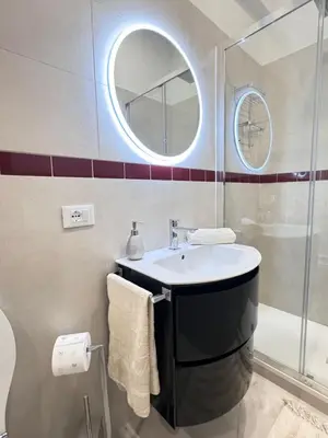 a bathroom with a sink and a mirror at Casa Giulia in Rome
