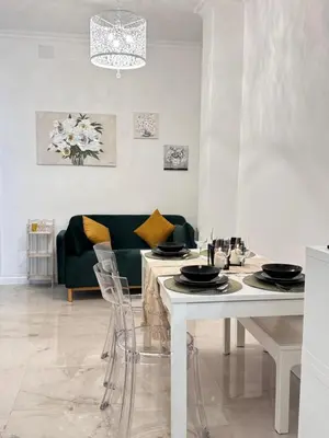 a living room with a table and a couch at Casa Giulia in Rome
