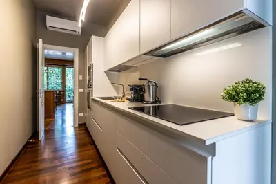 a kitchen with a sink and a counter top at Appartamento 
