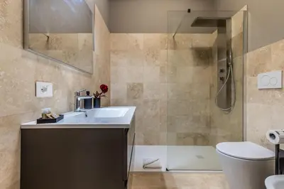 a bathroom with a sink and a shower at Appartamento 