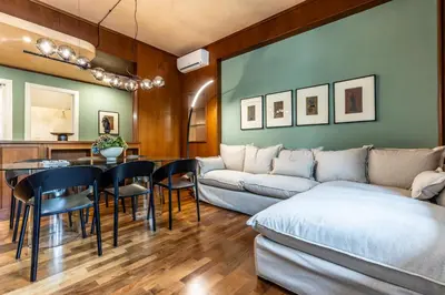 a living room with a couch and a table at Appartamento 
