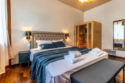 a bedroom with a large bed with towels on it at Appartamento 