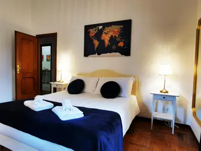 a bedroom with a bed with two towels on it at Key apartments Vatican Flat in Rome
